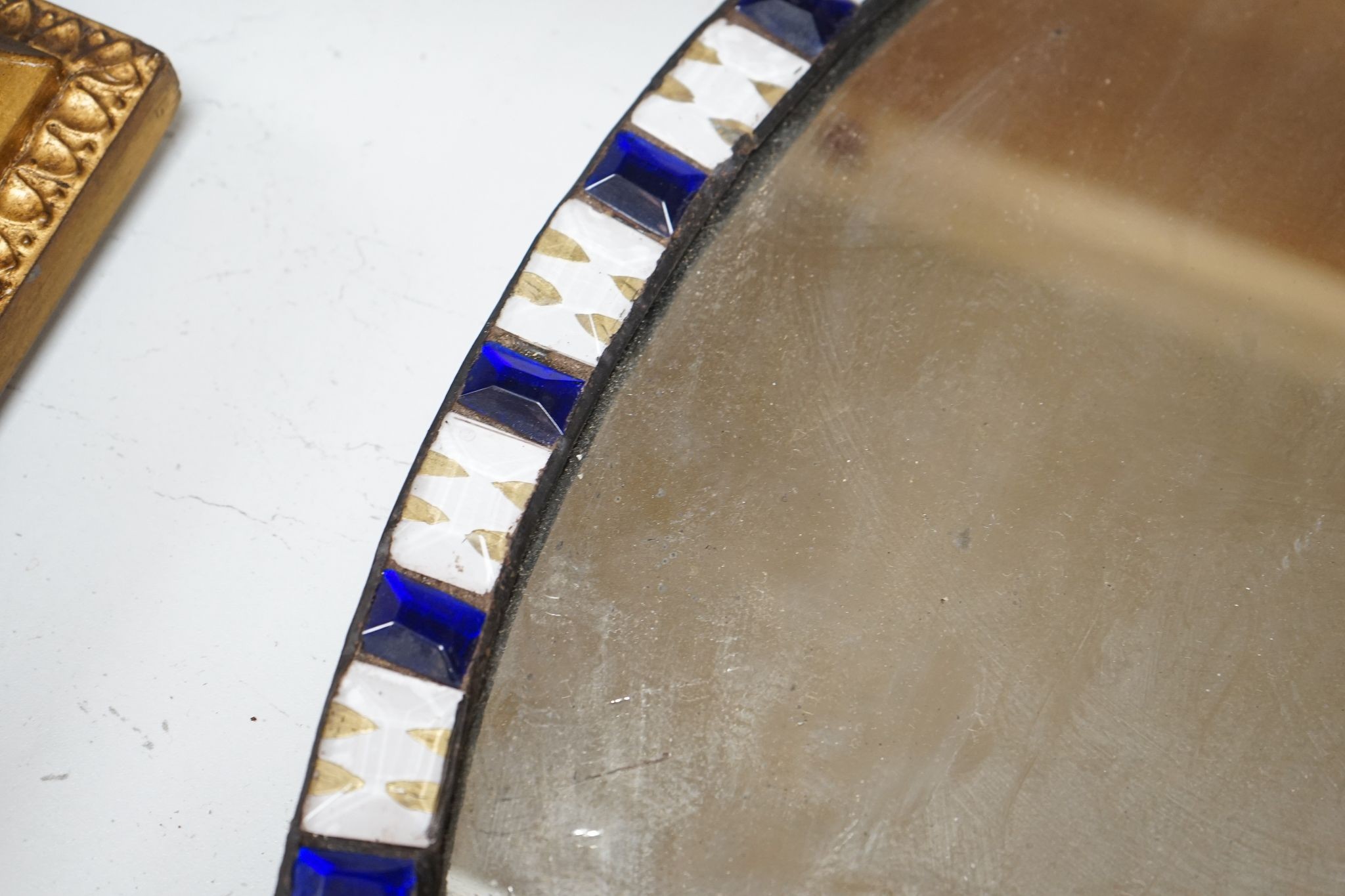 An oval Irish-style wall mirror, 56x41cm